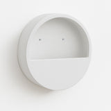 White Hanging Wally planter by Pottery Pots with screws, showcasing its sleek design and modern aesthetic.