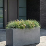 Gray Jort Fiberstone planter from Pottery Pots with a smooth finish and modern design, perfect for indoor or outdoor use.