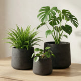 Set of three Patt Black Washed planters by Pottery Pots, showcasing a stylish matte black finish and modern design. || Abgebildete Größen: S, M & L