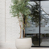 Jumbo Orb in grey washed finish by Pottery Pots, showcasing its round shape and textured surface against a neutral background.