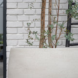 Grey washed Jumbo Orb planter by Pottery Pots, showcasing its round shape and textured finish in natural light.