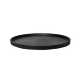 Runde schwarze Untersetzer von Pottery Pots auf einem Tisch, ideal zum Schutz von Oberflächen.