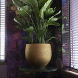 Gold washed Charlie orb planter by Pottery Pots, featuring a smooth, rounded design and elegant finish.