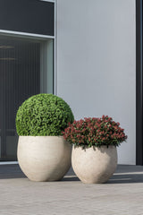 Grey washed Jumbo Orb planter by Pottery Pots, featuring a round shape and textured surface, ideal for indoor or outdoor use.